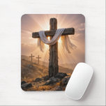 Mousepad Easter Crosses On a Hill<br><div class="desc">A central wooden cross,  covered with a white cloth and illuminated by the warm glow of the setting sun,  stands out against two additional crosses on a rocky hillside in the background</div>