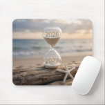 Mousepad New Year 2027 Hourglass on Driftwood Log<br><div class="desc">A sand timer sits on a weathered driftwood log by the beach,  showing the years 2026 and 2027,  next to a white starfish,  as a serene ocean and sky stretch out in the background</div>