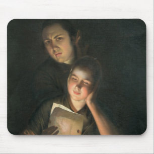 Mousepad Uma menina que lê uma letra pela luz de vela