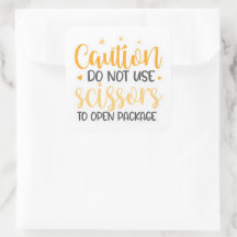 Não utilize o adesivo da tesoura