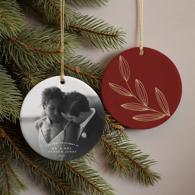 Nosso Primeiro Ornamento De Cerâmica De Prova De R (Our first Christmas couples photo ornament featuring a hand-drawn botanical sprout on ruby red.)