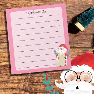 Notas Papai Noel está verificando sua lista no Bloco de 