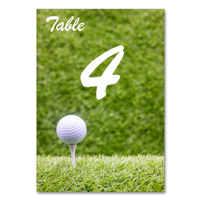 Numeração De Mesa Bolas de golfe em tee em grama verde (Frente)