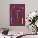 Numeração De Mesa Casamento Astronômico da Lua Solar MísticaGold<br><div class="desc">A Mística Plum Sun Moon Astronomy Wedding Table Number apresenta o sol dourado, a lua e as estrelas com um quadro de ouro sobre fundo de ameixa. Dentro é a sua informação de convite de casamento. Personalize editando o texto nas caixas de texto. NOTA: personalize com os números de tabela...</div>