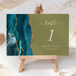 Numeração De Mesa Casamento Verde-Azul-Agate Dourado Teal<br><div class="desc">A borda esquerda desta elegante e moderna placa de número da mesa de casamento apresenta uma cor azul-lacrimogênea,  borda agitada com falso brilho dourado. O texto personalizável combina a escrita manual de marfim,  as fontes itálicas e em prato em um fundo verde-oliva.</div>