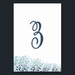 Numeração De Mesa Dusty Blue Greenery Wedding Table Number Card<br><div class="desc">Bring a polished and cohesive look to your reception tables with these elegant botanical wedding table number cards. Featuring soft dusty blue and muted green foliage along the base, this design adds a subtle, nature-inspired accent while maintaining a clean and modern aesthetic. The large script table number creates a graceful...</div>