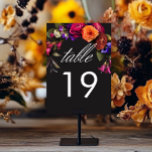 Numeração De Mesa Floral Elegante de Colheita de Vibrantes<br><div class="desc">Abraçar a beleza opulente de uma colheita floral de outono com o nosso cativo cartão de detalhes de casamento. Um fundo preto dramático, mas macio, proporciona a canvas perfeita para um buquê surpreendentemente realista. Imagine uma vibrante explosão de cor, apresentando rosas em laranja e magenta escura, com pequenas flores magenta...</div>