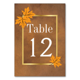 Numeração De Mesa Folhas de laranja na mesa de casamento marrom