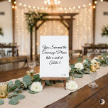 Numeração De Mesa Funny "You Survived the Ceremony" Minimalist Weddi<br><div class="desc">Add a touch of humor to your wedding reception with this witty table number card! Featuring the playful phrase "You Survived the Ceremony! Please take a seat at, " this minimalist design uses elegant black script calligraphy on a crisp white background. It's the perfect icebreaker for your guests. Easily personalize...</div>