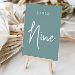 Numeração De Mesa Mão de Dusty Teal Scripted NINE<br><div class="desc">Cartões simples e chic em aqua empoeirado e branco fazem uma declaração elegante no seu casamento ou evento. Design apresenta "mesa [number]" em uma combinação de olhares de serif clássica e de caracteres de script manuscritos. Design repete-se de ambos os lados. Cartões numerados individualmente vendidos separadamente; solicite cada número de...</div>