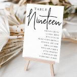 Numeração De Mesa Mesa com script manual NINETEEN   Nomes de convida<br><div class="desc">Cartões simples e chic em preto e branco clássico fazem uma declaração elegante no seu casamento ou evento. Design apresenta "mesa [number]" em uma combinação de olhares de serif clássica e de caracteres de script manuscritos, com nomes individuais de convidados por baixo. Design repete-se de ambos os lados. Cartões numerados...</div>