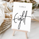 Numeração De Mesa Mesa com script preto e branco OITO<br><div class="desc">Cartões simples e chic em preto e branco clássico fazem uma declaração elegante no seu casamento ou evento. Design apresenta "mesa [number]" em uma combinação de olhares de serif clássica e de caracteres de script manuscritos. Design repete-se de ambos os lados. Cartões numerados individualmente vendidos separadamente; solicite cada número de...</div>