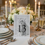 Numeração De Mesa Minimalist Wedding | Elegant Black & White Photo<br><div class="desc">Guide your guests in style with elegant, modern table numbers. This minimalist wedding table number features a clean black-and-white design with a subtle photo overlay, perfectly matching your wedding invitation suite. The bold typography ensures easy visibility while maintaining a refined and sophisticated look. Designed for modern couples, it adds a...</div>