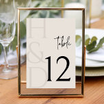 Numeração De Mesa Modern Black and Ivory Monogram Minimalist Wedding<br><div class="desc">Guide your guests with elegance and style using the Modern Black and Ivory Monogram Minimalist Wedding Table Number, a sophisticated detail designed to complement a refined and contemporary wedding celebration. Featuring a timeless black and ivory color palette paired with clean minimalist typography, this table number design brings clarity and visual...</div>