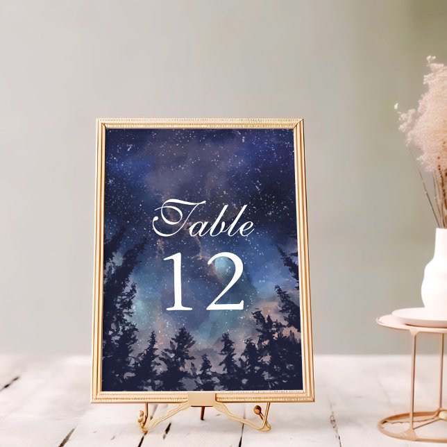 Numeração De Mesa Número da Mesa do Casamento Celestial da Floresta  (Starry Night Forest Wedding Table Numbers on a white wooden table in a golden frame.)