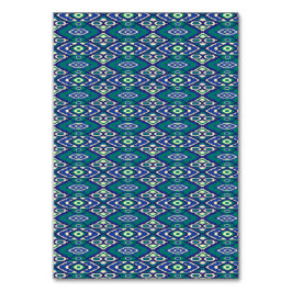 Numeração De Mesa Um padrão simétrico de motivos azuis num tecido