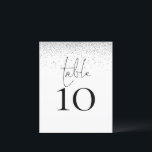 Número de Mesa de Casamento em Letra de Glitter Pr<br><div class="desc">Um tamanho 4, 5 x 5, 6” semi-brilho 110lbs de peso, que é de espessura semelhante a um cartão-postal, com UM por folha. Número de Mesa de Casamento em Letra de Glitter Prata. Um design elegante com mesa em um estilo de letra manuscrita e o número da sua mesa abaixo....</div>