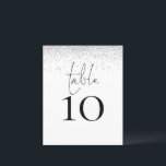 Número de Mesa de Casamento em Letra de Glitter Pr<br><div class="desc">Um tamanho 4, 5 x 5, 6” semi-brilho 110lbs de peso, que é de espessura semelhante a um cartão-postal, com UM por folha. Número de Mesa de Casamento em Letra de Glitter Prata. Um design elegante com mesa em um estilo de letra manuscrita e o número da sua mesa abaixo....</div>