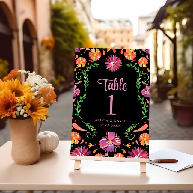 Número de Mesa para Casamento Floral Fiesta Mexica (Black Mexican Floral Fiesta Wedding Table Number on a table with flowers.)