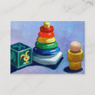 O BEBÊ BRINCA O CARTÃO DE VISITA