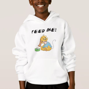 O filhote de cachorro alimenta-me o camiseta e os