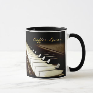 O PIANO FECHA a caneca do bebendo do melómano