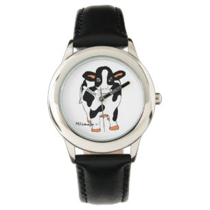 O relógio do miúdo preto e branco da vaca