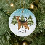 Ornamento De Cerâmica Airedale Terrier Dog Snowy Winter Forest E Nome<br><div class="desc">A ilustração original do desenho de Destei de um cão da raça Airedale Terrier. O cão é colocado numa cena de inverno com três árvores de abeto verde e neve caindo. O fundo é um gradiente azul a branco que dá à design aquele olhar frio do dia de inverno. Há...</div>