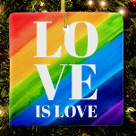 Ornamento De Cerâmica Amor é Orgulho gay Arco-Íris<br><div class="desc">O amor é o amor. Celebre o amor,  a igualdade e o Mês do Orgulho de junho. Este Ornamento do Ornado Orgulho é decorado com listras do arco-íris e tipografia na moda em fundo arco-íris de cor d'água,  vermelho,  laranja,  amarelo,  verde,  azul e roxo. Original Watercolor © Michele Davies.</div>