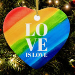Ornamento De Cerâmica Amor é Orgulho gay Coração Arco-Íris<br><div class="desc">O amor é o amor. Celebre o amor, a igualdade e o Mês do Orgulho de junho. Este Ornamento do Ornamento do Orgulho tem forma cardíaca e é decorado com listras arco-íris e tipografia na moda em fundo arco-íris de cor d'água de vermelho, laranja, amarelo, verde, azul e roxo. Original...</div>