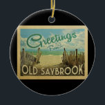 Ornamento De Cerâmica Antiga Viagens vintage de praia Saybrook<br><div class="desc">Esta design do Vintage Saybrook apresenta uma praia arenosa com uma bela água turquesa oceânica e acima do mar,  um céu azul com nuvens brancas onduladas. No estilo viagens vintage.</div>