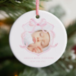 Ornamento De Cerâmica Anúncio da Bebê Fotográfica Rosa<br><div class="desc">Este ornamento de anúncio de nascimento apresenta um design suave e elegante. Ele exibe uma foto de um bebê recém-nascido moldado por uma delicada fita cor-de-água rosa na forma de um arco. Com um esquema de cor rosa e branca, faz uma escolha perfeita para anunciar a chegada da sua menina....</div>
