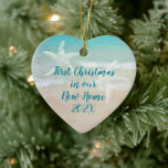 Ornamento De Cerâmica Beach New Home First Christmas Starfish<br><div class="desc">Primeiro Natal num ornamento tropical/praial. Manutenção cerâmica em forma de coração com texto em ambos os lados. Inclua o evento com data de um lado e nomes e endereços do outro. A água do mar e a areia da praia são o fundo do texto azul escuro. Dois estrelas-do-mar também decoram...</div>