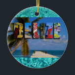 Ornamento De Cerâmica Belize Tropical Beach Blue Ocean Natal<br><div class="desc">Mostre seu amor pelo país de Belize nesta temporada de festas com este brilhante e divertido Enfeites de natal contendo fotos de Ambergris Caye, Caye Caulker e ruínas maias. Uma colagem de cores maravilhosa é imposta sobre uma cena tropical fora de foco com palmeira e doca. O fundo contém uma...</div>