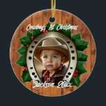 Ornamento De Cerâmica Belo Holly e Ferradura Primeiro Natal<br><div class="desc">Uma ferradura e folhas sagradas fazem um quadro perfeito para o primeiro feriado de Natal do seu filho.</div>