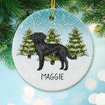 Ornamento De Cerâmica Black Labrador Retriever Winter Forest Nome Person<br><div class="desc">A ilustração original do desenho de Destei de um lindo cão negro da raça Labrador Retriever. O cão é colocado numa cena de inverno com três árvores de abeto verde e neve caindo. O fundo é um gradiente azul a branco que dá à design aquele olhar frio do dia de...</div>
