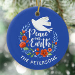 Ornamento De Cerâmica Blue White Dove Peace on Earth Christmas<br><div class="desc">Um bonito Enfeites de natal com uma pomba em uma coroa floral com as palavras Paz na Terra. O Enfeites de natal é projetado em azul real,  vermelho e branco. Um ornamento elegante para sua árvore de Natal. Personalize com seu nome. Projetado para você pelo Blackberry Boulevard.</div>