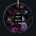 Ornamento De Cerâmica Buquê Floral Roxo Gótico em Lace com Ravens<br><div class="desc">Este ornamento é perfeito para um casamento gótico moderno e elegante. O moody floral design apresenta um buquê natural de flores roxas em um arranjo luxuoso em um fundo roxo escuro e preto com dois corvos. Você pode personalizar com seus primeiros nomes</div>