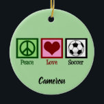 Ornamento De Cerâmica Café da Paz - Natal Personalizado<br><div class="desc">Enfeites de natal de futebol bonito com sinal de paz,  coração e bola de futebol em verde legal com sua personalização sob o PEACE LOVE SOCCER. Personalizado feito com seu texto em preto na parte inferior.</div>