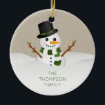Ornamento De Cerâmica Cartoon Snowman Com Nome Personalizável Natal<br><div class="desc">A divertida ilustração de desenho animado de um bonitinho bonitinho. O boné de neve está vestindo um chapéu preto e um cachecol que tem listras verdes e brancas. A cor de fundo é bege com um padrão de pontos brancos. Sob o boneco de neve há uma área de texto personalizável...</div>