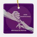 Ornamento De Cerâmica Casal romântico de aniversário de cliente de mãos<br><div class="desc">Esta design tem um marido e uma esposa com os dedos mindinhos trancados juntos. Este casal romântico está de mãos dadas para celebrar o aniversário do casamento. Você pode personalizar esta design cor-de-rosa e roxa com sua própria data e nomes de aniversário de casamento.</div>