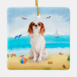 Ornamento De Cerâmica Cavalier King Dog em Beach<br><div class="desc">Um cachorro bonito sentado na praia é uma ideia perfeita para alguém que ama essa raça de cachorro.</div>