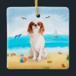Ornamento De Cerâmica Cavalier King Dog em Beach<br><div class="desc">Um cachorro bonito sentado na praia é uma ideia perfeita para alguém que ama essa raça de cachorro.</div>
