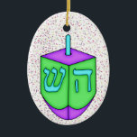 Ornamento De Cerâmica Chanukah Dreidel<br><div class="desc">Divirta-se com isso. Pense em temas! Jogue com cores de fundo, adicione ou exclua texto e (por um pouco de taxa extra) personalize o verso com imagens, cores, logotipo / informações comerciais, etc.! Estas também são excelentes para presentes ou para usar como toque final da aula no seu invólucro de...</div>