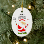 Ornamento De Cerâmica Coletor de Natal Badminton<br><div class="desc">Engraçado maldito jogando Papai Noel.</div>