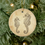 Ornamento De Cerâmica Costeiros Vintage Personalizados Ocean Beach<br><div class="desc">Este ornamento da árvore de Natal na praia apresenta imagens antigas de uma mãe e de um cavalo marinho bebê. Eles são colocados contra um fundo de papel de estilo antigo. Ele pode ser personalizado com um nome e ano ou qualquer texto que você queira adicionar. Alguns gráficos por Origens...</div>