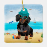 Ornamento De Cerâmica Dachshund Dog em Beach<br><div class="desc">Um cachorro bonito sentado na praia é uma ideia perfeita para alguém que ama essa raça de cachorro.</div>