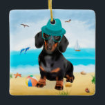Ornamento De Cerâmica Dachshund Dog em Beach<br><div class="desc">Um cachorro bonito sentado na praia é uma ideia perfeita para alguém que ama essa raça de cachorro.</div>