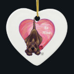 Ornamento De Cerâmica Dia de os namorados de Cachorro<br><div class="desc">Parada Animal Romântico Cão Cachorro Cachorro Coração e Amor presentes, cartas, e acessórios trazidos para você pela Imagine isso! Design apresenta nossa trabalho de arte divertida de um cão de caça marrom segurando um rosa bonito na boca com corações roxos, vermelhos e cor-de-rosa atrás pintados digitalmente pelo artista infantil, Traci...</div>