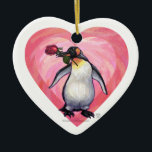 Ornamento De Cerâmica Dia de os namorados de pinguim<br><div class="desc">Parada Animal Romântico Presentes e Acessórios para o Dia do Namorados Pinguim e Corações apresenta nossa trabalho de arte divertida de um pinguim bonitinho segurando um rosa bonito na boca com corações roxos, vermelhos e cor-de-rosa em camadas atrás dela criado pelo nosso talentoso artista Traci Van Wagoner. Nosso divertido pinguim...</div>